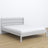 Double bed grey – wooden headboard, close-up of wood quality