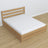 Double bed natural oak – oak legs and base, close-up